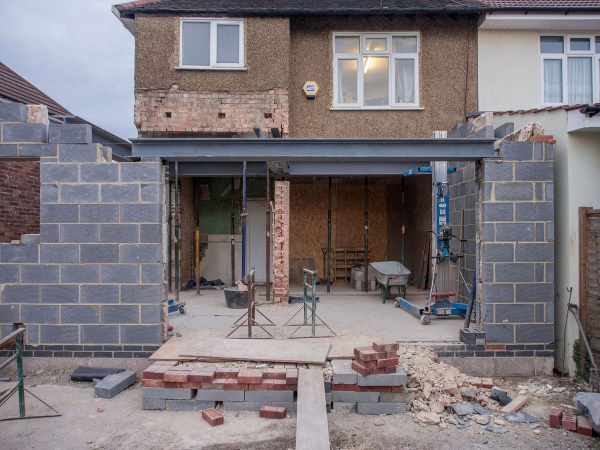 House extension in progress with a steel beam across the new opening